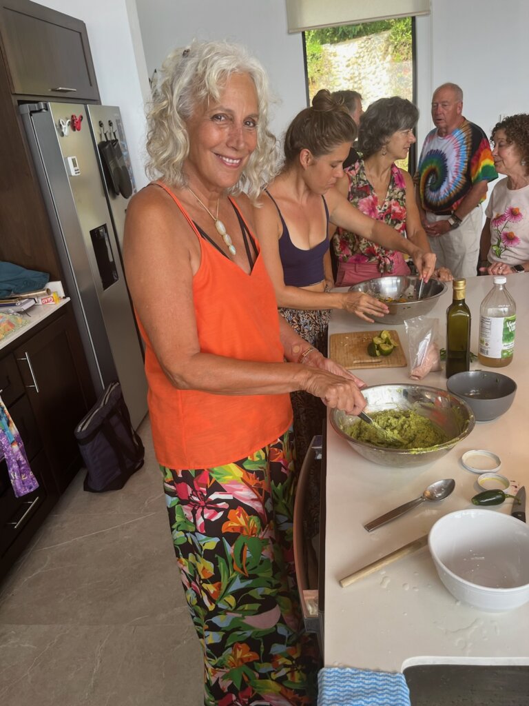Beth Greer and group preparing and sharing a meal | Credit: Beth Greer